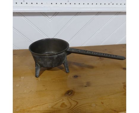 An antique bronze Wasbrough three legged Skillet, W 16 cm x H 11 cm x D 38 cm.