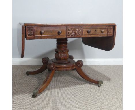 A Regency mahogany and rosewood banded Sofa Table, raised on carved column and quadraform reeded supports, W 95 cm x H 71.5 c
