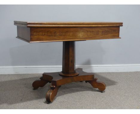 A 19th century mahogany card Table, with campaign hinges and raised on octagonal column and carved quadraform base, upon cast