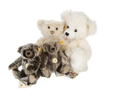 Four yellow tagged Steiff Teddy Bears: three jointed Classic bears; and one unjointed soft stuffed Lizzy bear