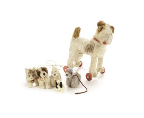 Steiff post - war Dogs and Cat: a Tabby cat with chest tag - 4¼in. (11cm.) long; a Cockie with chest tag; two Snooby poodles,