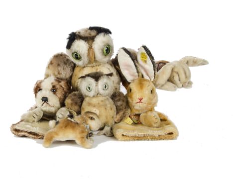 Six post - war Steiff animals: comprising two Wittie owls, the smaller with button, yellow cloth tag and chest tag - 9in. (23