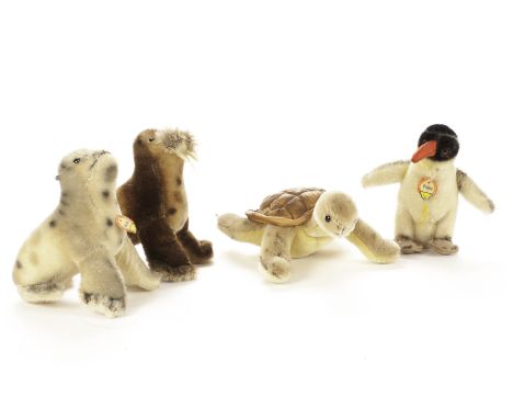 Steiff post - war Aquatic animals: a Paddy Walrus - 4¾in. (12cm.) high; a Robby seal with chest tag; a Peggy penguin with che