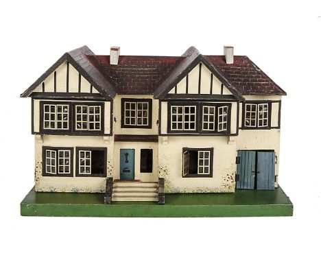 A Tri-ang dolls’ house, late 1930s, cream painted with brown painted mock Tudor timbers, over hanging first floor windows, ga
