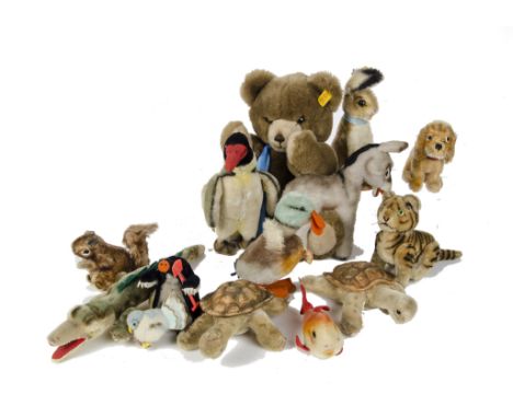 Steiff post - war animals including a Peggy penguin - 8in. (20cm.) high; a jointed tiger cub; a begging rabbit; two Slo torto