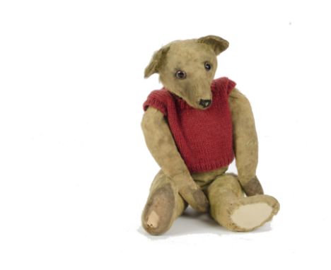 An early British Teddy Bear, 1920s, with golden mohair, clear and glass eyes with reddish brown backs, swivel head, jointed l