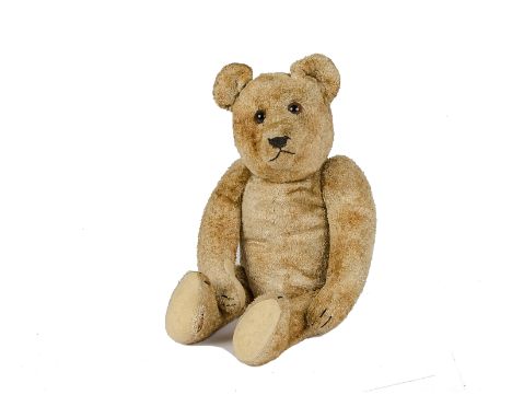 An unusual German Teddy Bear, 1940s, with golden toweling plush, clear and black glass eyes with brown backs, pronounced muzz