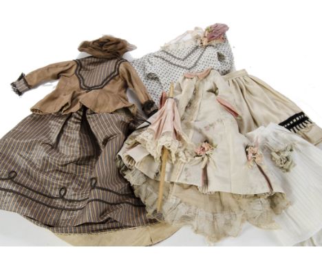 Fashionable doll’s clothes: a modern well made dress with cream silk with floral garlands, lace trim, antique enamel buttons 