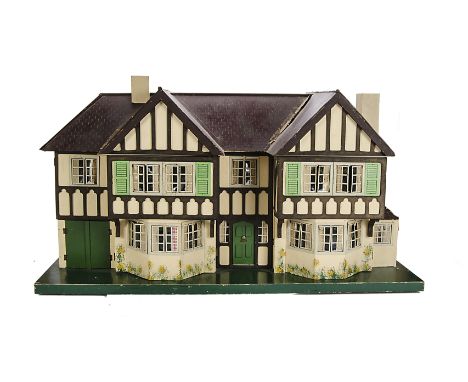 A large Tri-ang Stockbroker dolls’ house No.93, circa 1939, painted cream with mock Tudor half timbering, two stories, two ba