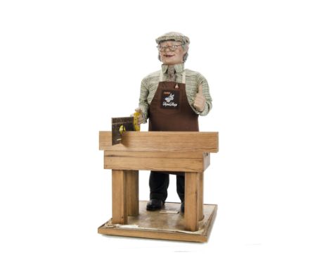 A J.H. Animation carpenter Keden advertising shop window automaton, latex rubber figure wearing glass, flat, apron, shirt, ti