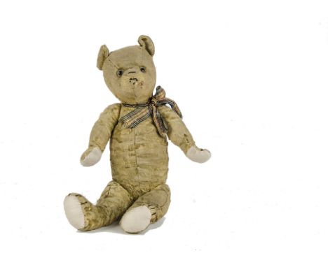 A Chiltern artificial silk plush Teddy Bear, the property of B. Taylor, 1930s, with yellow plush, clear and black glass eyes 