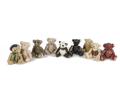 Nine brass jointed Steiff Teddy Bears: including black, red and panda, in original velvet bags - 2in. (5cm.) high
