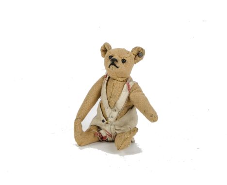 A small Steiff Teddy Bear, circa 1910, with bald golden mohair, black boot button eyes, pronounced muzzle, black stitched nos