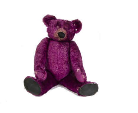 An extremely rare Chad Valley purple mohair Teddy Bear, 1930s, with central seam, pronounced clipped muzzle, black stitched b