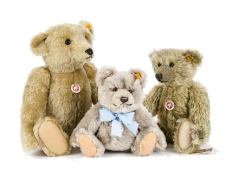 Three Steiff yellow tagged Teddy Bears: a 1906 Teddy Bear - 20in. (50.5cm.) high; a light brown Jackie; and another