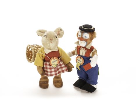 A rare Steiff Clownie clown, 1950s, of moulded rubber, cloth shirt and trousers, felt hat, collar and shoes, mohair wig and c