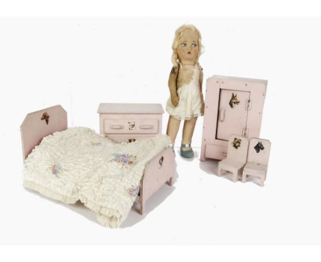 A doll’s bedroom set made by Disabled Ex - Service Men at the British Legion Village, painted pink comprising bed, wardrobe -