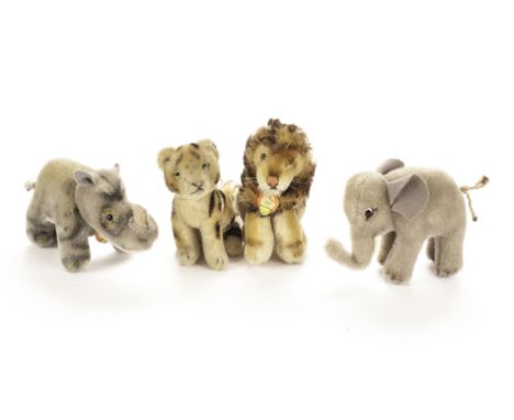 Steiff post - war Wild Animals: a seated Tiger cub with swivel head and script button - 4¼in. (11cm.) high; a Nosy rhinoceros