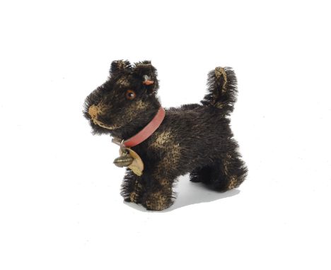 A small 1930s Steiff Scotty Dog, No.1308,0, with black mohair, brown and black glass eyes, pink stitched nose and mouth, swiv