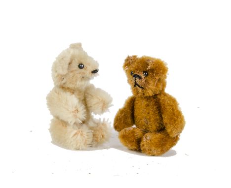 Two Schuco miniature Teddy Bears, 1950s, one cinnamon and one light golden mohair, both with metal pin eyes, black stitched n