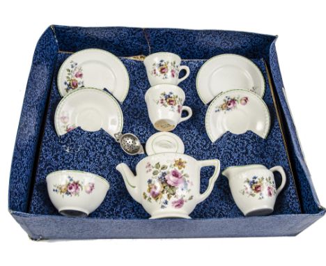 An Ellar (English) pottery child’s tea set, 1950s, two cups, saucers and side plates, teapot, sugar bowl and milk jug with tr