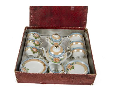 A 1930s Japanese child’s tea set, six cups, saucers and side plates, teapot, sugar pot and milk jug decorated with flowers, i