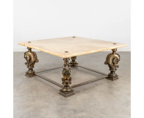 Deknudt, a coffee table with bronze horse heads and an onyx table top. Not marked. (90 x 90 x 41cm)