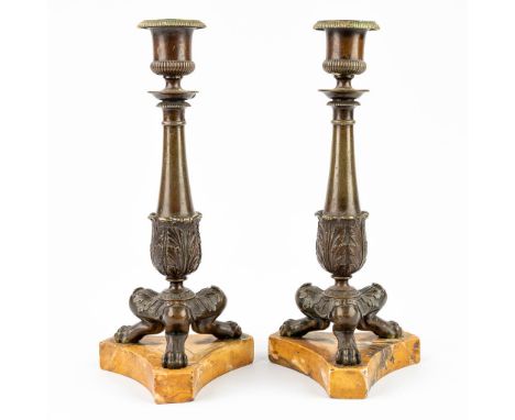 A pair of candlesticks made of bronze and mounted on an onyx base. Empire period, the first half of the 19th century. Conditi