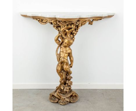 A wood-sculptured wall console decorated with putti in Louis XV style. Finished with a white marble top. Circa 1900. (47 x 10