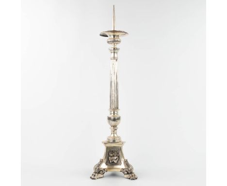 A church candlestick made of silver-plated metal, standing on claw feet. (18 x 18 x 78cm)