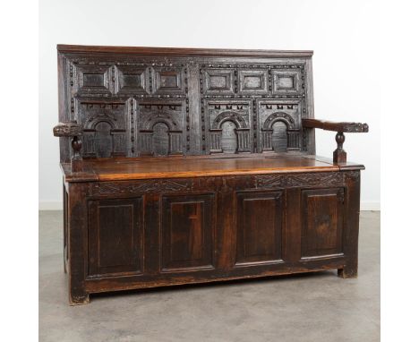 An antique hall bench decorated with sculptured animals and panels. Marked RC 1718. (62 x 146 x 114cm)