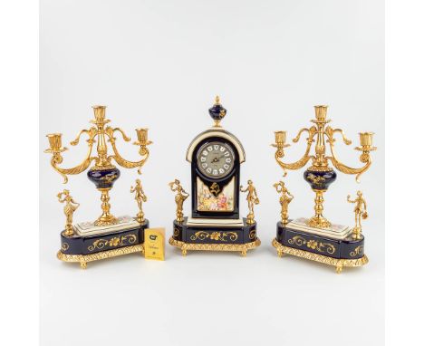 Limoges, a three-piece mantle garniture clock and candelabra, blue porcelain and bronze. Marked Campostrini e trallori and Li