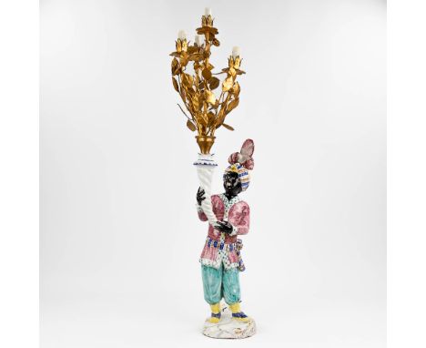A 'Blackamoor' standing lamp made of glazed terracotta. Made in Italy,Ê20th century. (105cm)
