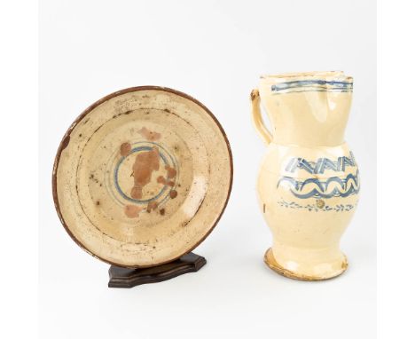 An antique plate and pitcher made of glazed faience. 18th century. Condition: Generally in good condition with hairlines in t