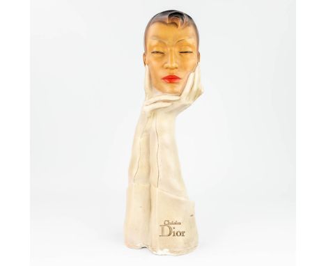 Christian Dior, a vintage advertising sculpture made of patinated plaster. (13 x 19 x 57cm)