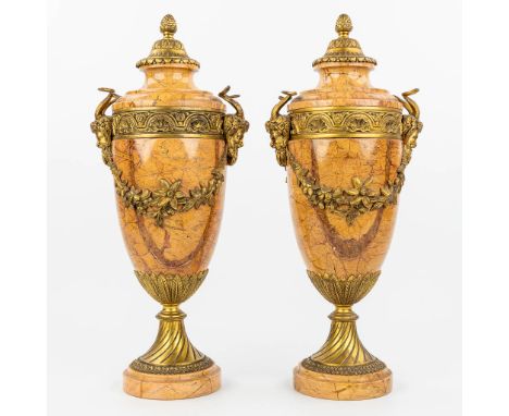 A pair of marble cassolettes mounted with gilt bronze in Louis XVI style and decorated with Satyr figurines. (15 x 20,5 x 48,