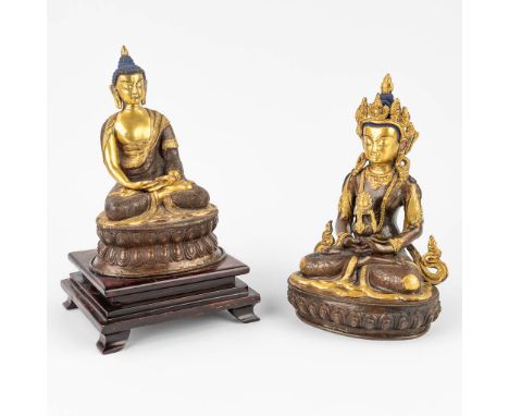 A collection of 2 Goldface buddha's made of copper and bronze. (16 x 13 x 25 cm)