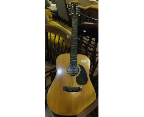 A Lorenzo Model N102/K twelve string acoustic guitar, bearing label inscribed "Specially made for Fletcher Coppock & Newman"