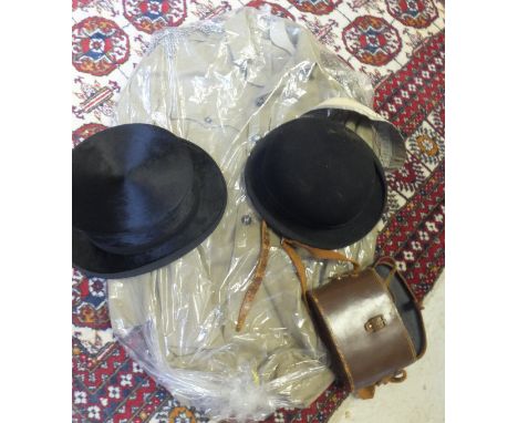 A black silk top hat, a black felt bowler hat, a Calcutta Light Horse khaki military style jacket, two pairs of binoculars, a