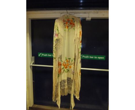 An early 20th Century silk shawl, the cream ground with embroidered floral decoration and tassels CONDITION REPORTS Approx 13