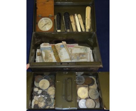 A tin money box containing various British coinage, to include commemorative crowns, assorted bank notes, a wooden cased pock