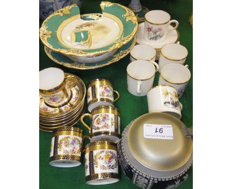 A set of six Royal Worcester coffee cans and saucers decorated with flowering plants, a collection of Paragon china coffee ca