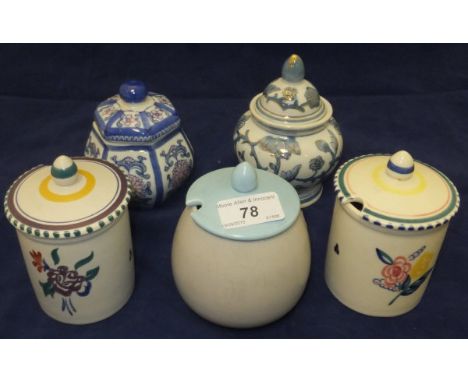Two Poole pottery preserve pots decorated with floral sprays, a Poole pottery preserve jar in grey with pale blue lid, togeth