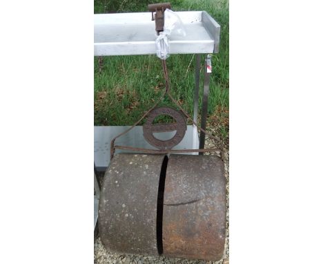 A cast iron garden roller