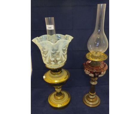 A late Victorian brass oil lamp with vaseline glass handkerchief shade and plain chimney, together with a further copper bodi
