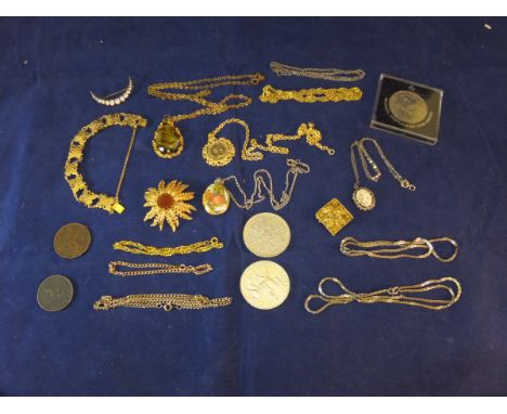 A collection of costume jewellery to include brooch in the form of a stylised flower head, various chain necklaces, floral fi