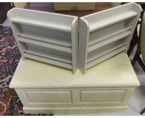 A modern cream painted blanket box / trunk and a pair of cream display shelves