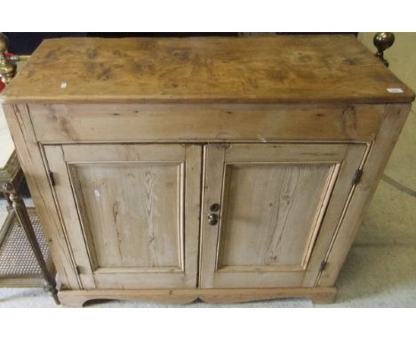 A Victorian pine and elm kitchen cupboard with two panelled doors on bracket feet