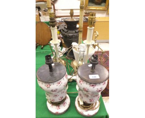 Two ceramic bodied table lamps, a table lamp in the Classical urn manner with goat mask handles, two bamboo effect table lamp