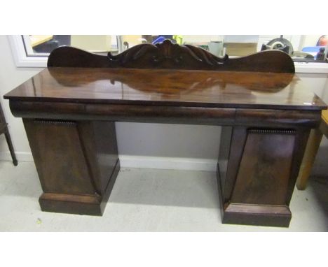 A late Regency/William IV mahogany pedestal sideboard, the raised foliate decorated back over three cushion drawers on two ar